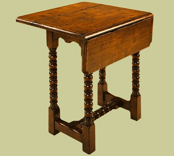 Oak folding top lamp table, with 17th century style bobbin turned legs and centre stretcher.
