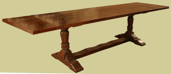 Extending oak pedestal dining table