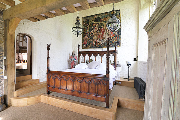 Unique Gothic style carved oak bed in converted chapel